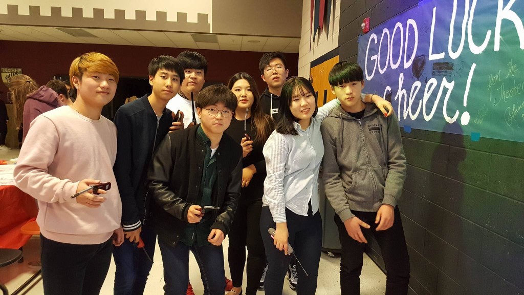 Korean students getting ready to light floating lanterns.